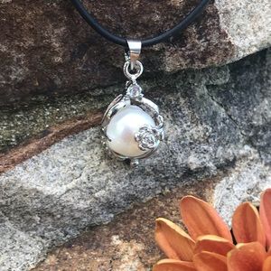 Single real pearl on leather cord